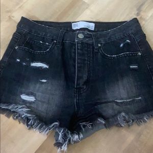 Black lightly distressed denim shorts